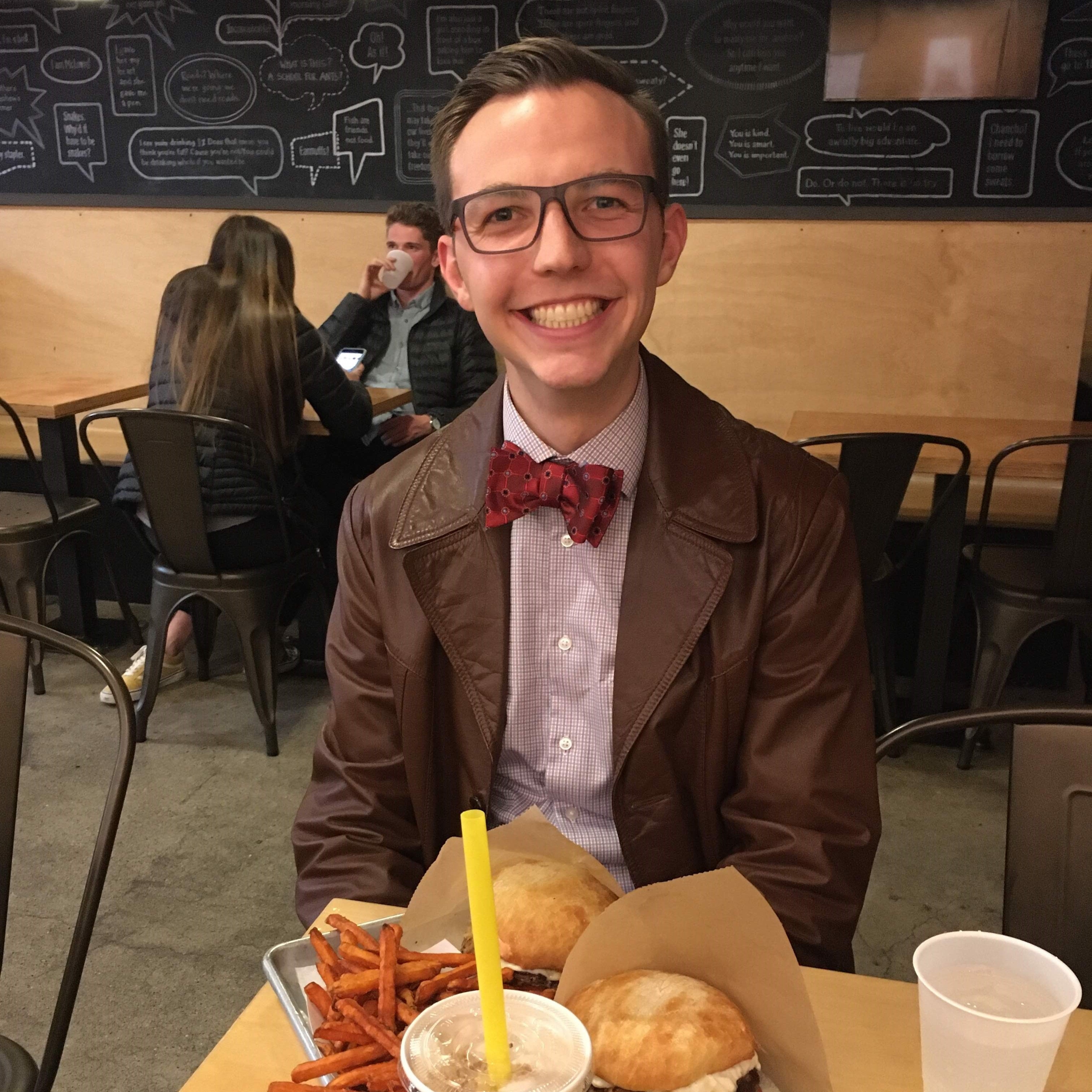 Photo of me, well dressed, in an upscale food court