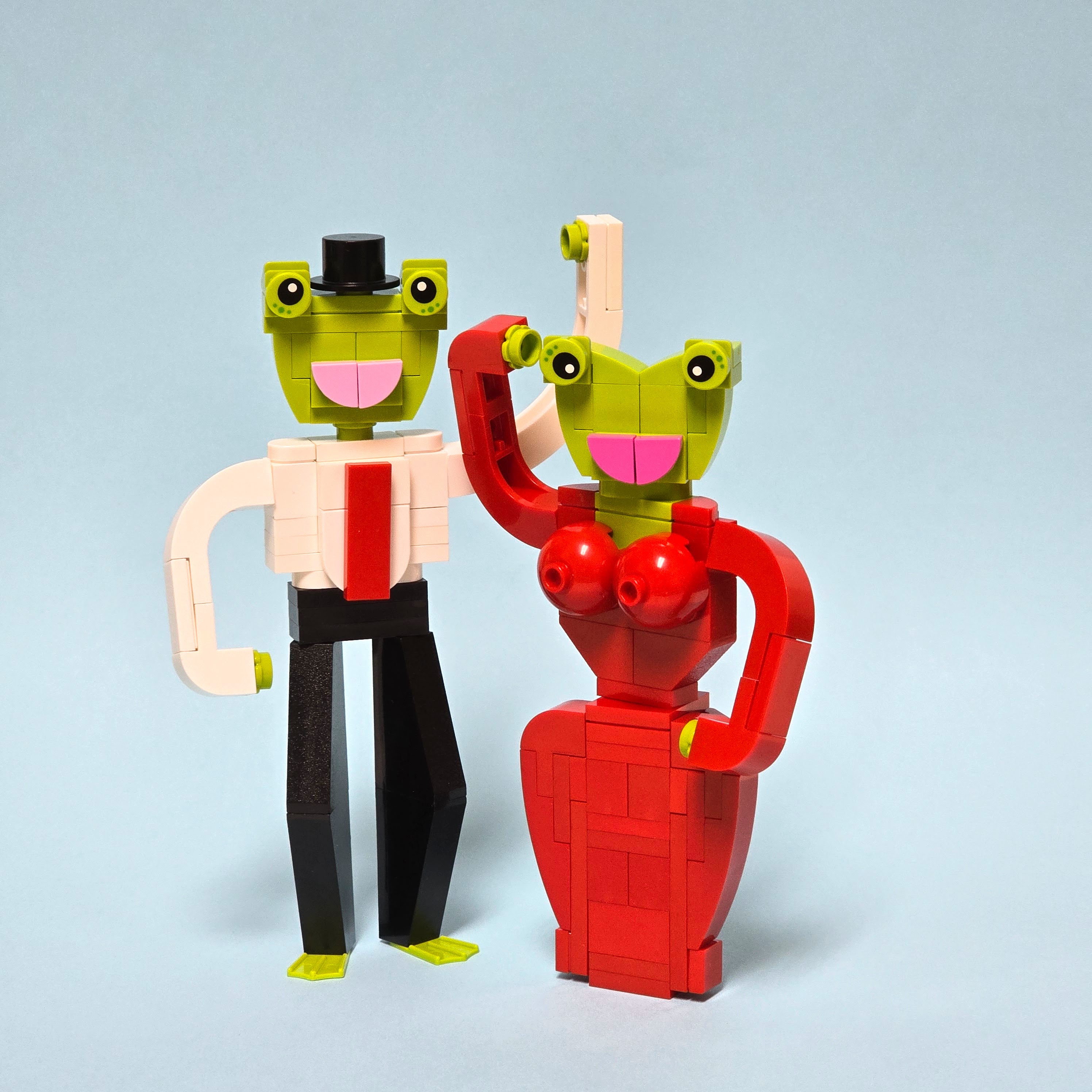 Two frogs, dancing with each other, made of Legos, created by Alex Lyman