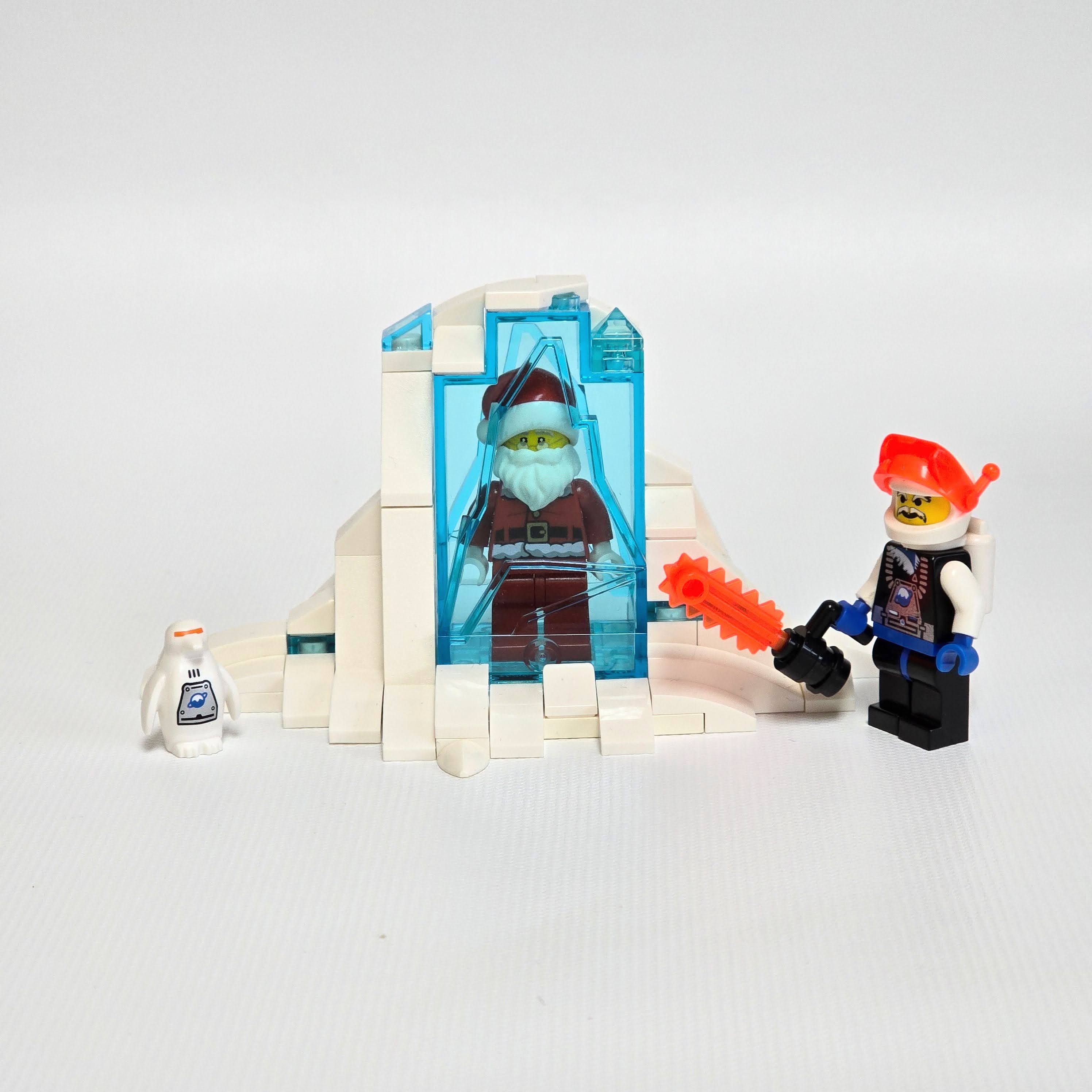 Lego Ice Planet astronaut freeing Santa from ice, created by Alex Lyman