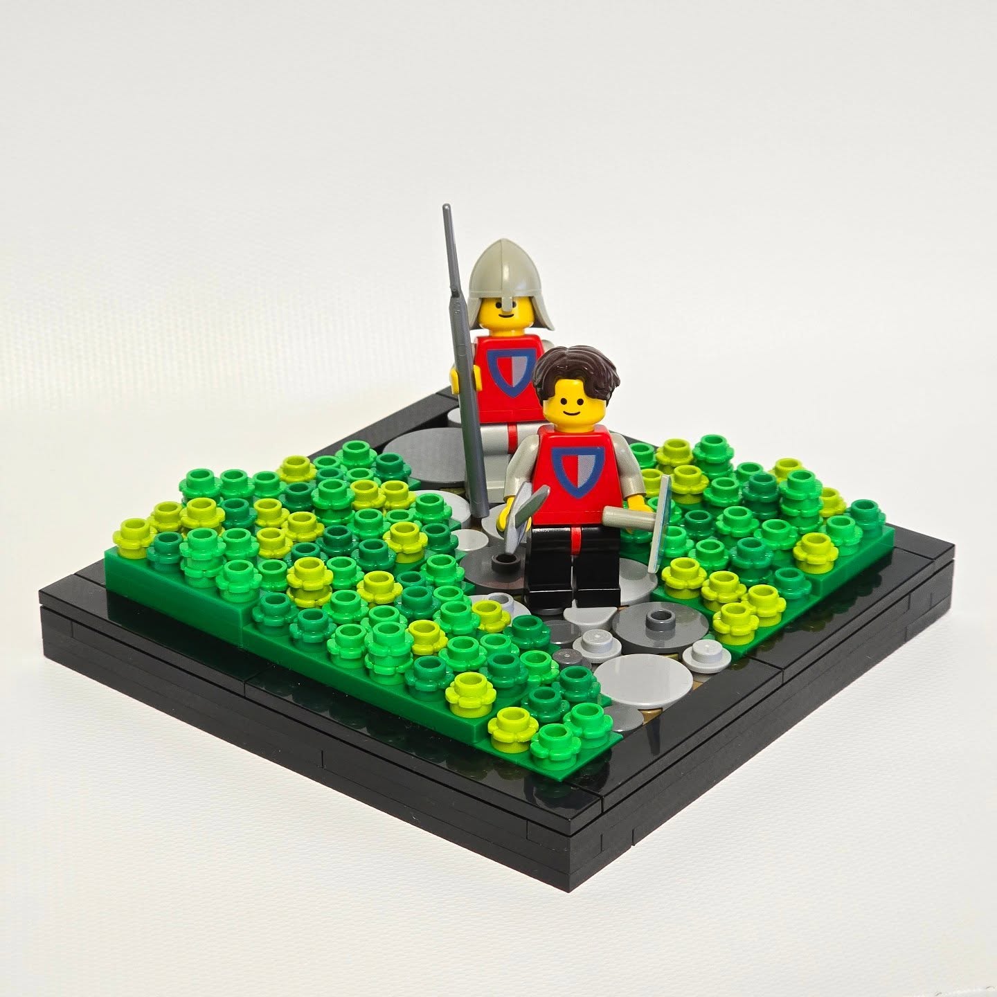 Two Lego knighs walking through a field