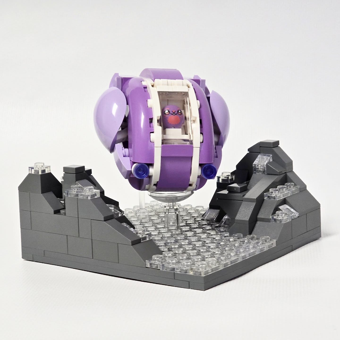 Purple Lego spaceship with little bunny inside