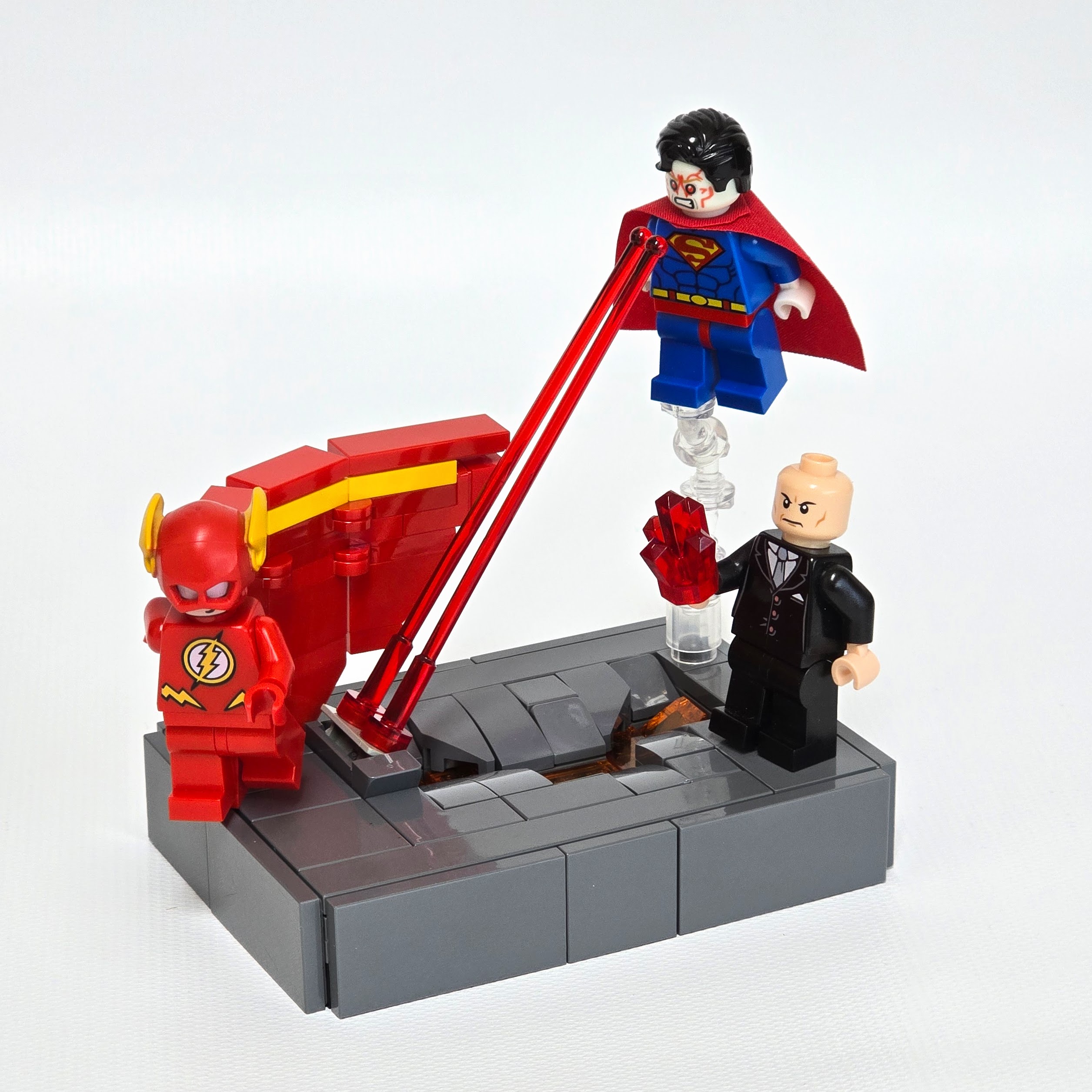 Lego Superman attacking the Flash after being poisoned by Lex Luthor with red Kryptonite, created by Alex Lyman
