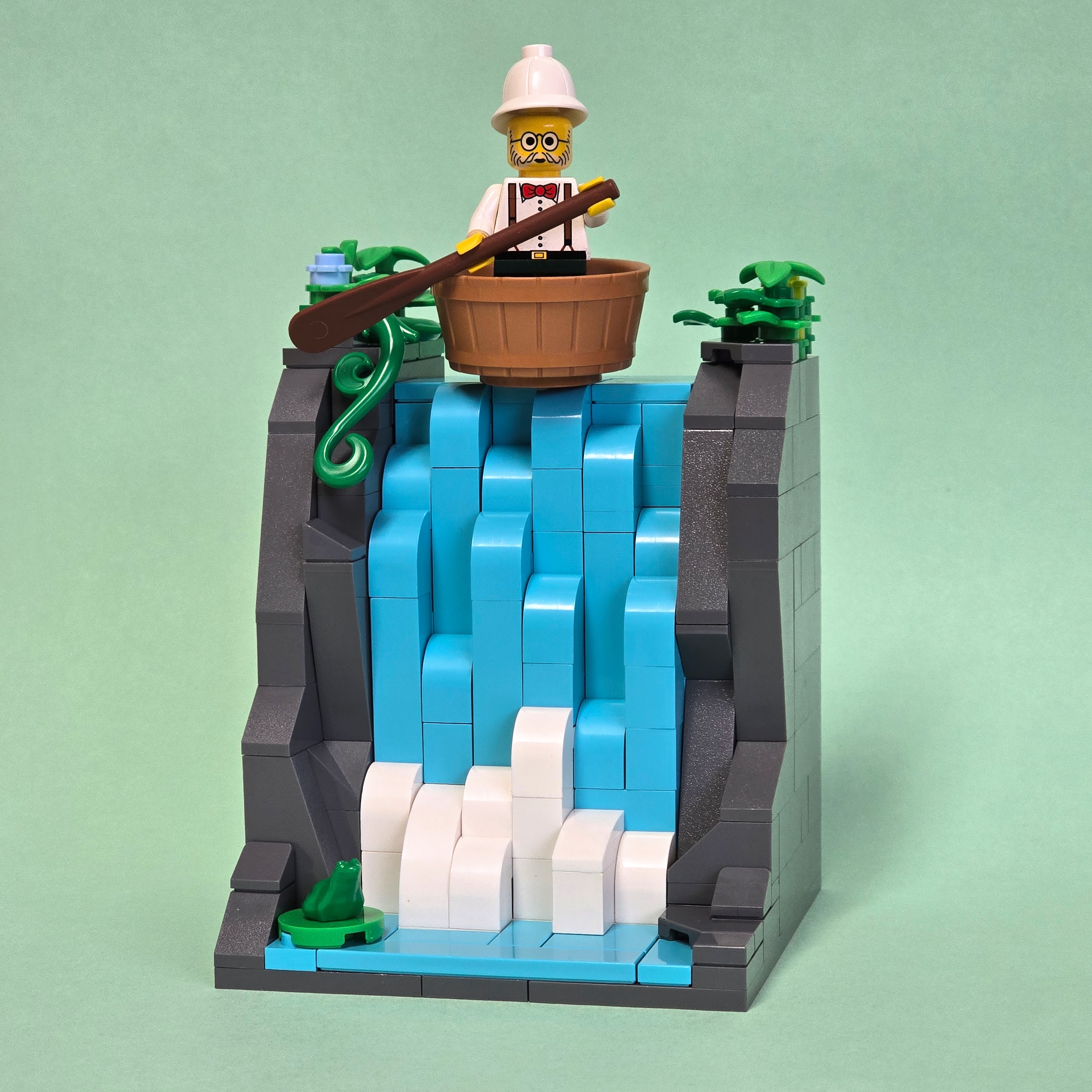 Lego waterfall with Dr. Kilroy going over the edge in a bucket, created by Alex Lyman